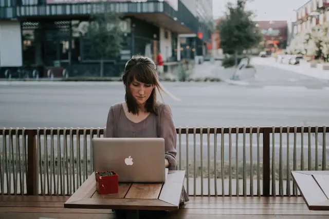 woman working on computer outside