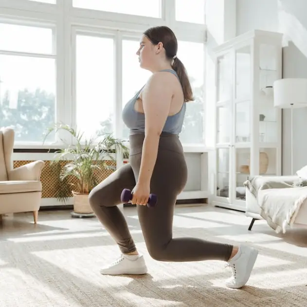woman doing lunges in living room