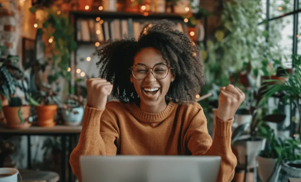 A happy remote worker celebrating getting an offer letter for a new job