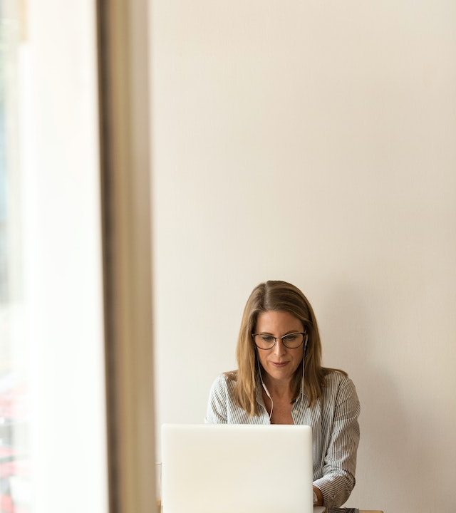 woman working on computer at coworking space